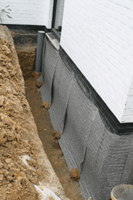 Traitement de l'humidite des murs contre terre : protection extérieure